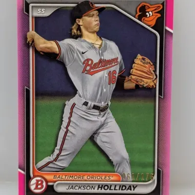 Sale Photo Thumbnail #429: Bowman Jackson Holliday Baltimore Orioles baseball trading card featuring a pink border, serial-numbered 061/175.