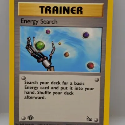 Sale Photo Thumbnail #808: 1st Edition Pokémon Energy Search Trainer trading card #59/62 from the 1999 Fossil set.
