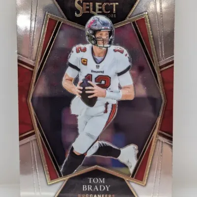 Sale Photo Thumbnail #936: 2021 Panini Select Tom Brady #12 football trading card featuring his Tampa Bay Buccaneers uniform.
