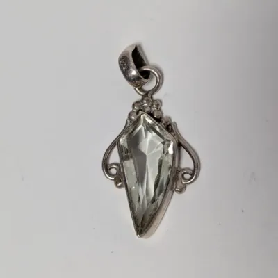 Sale Photo Thumbnail #984: Sterling silver pendant featuring a kite-cut pale green prasiolite crystal set in a ornate beaded frame.
