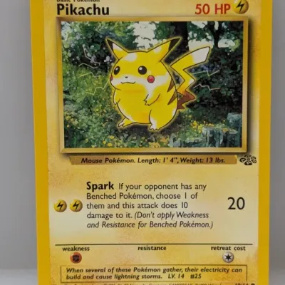 Sale Photo Thumbnail #486: 1999 Pokémon Jungle Set Pikachu trading card, number 60/64, featuring artwork by Ken Sugimori.