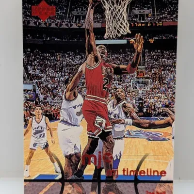 Sale Photo Thumbnail #641: 1998-99 Upper Deck MJ Timeline Michael Jordan trading card featuring a action shot during the NBA Finals against the Utah Jazz.
