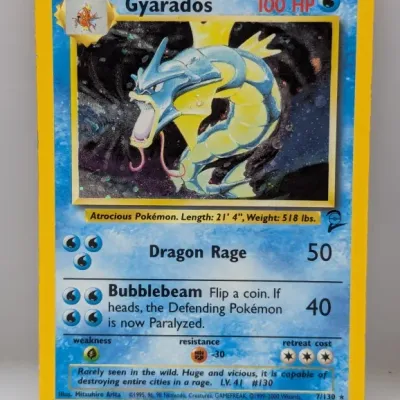 Sale Photo Thumbnail #746: Base Set 2 holographic Gyarados Pokémon trading card, numbered 7/130 and illustrated by Mitsuhiro Arita.