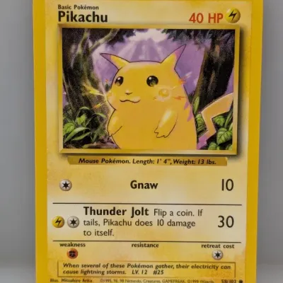 Sale Photo Thumbnail #867: 1999 Pokémon Base Set Pikachu card (#58/102), illustrated by Mitsuhiro Arita, in well-preserved vintage condition.