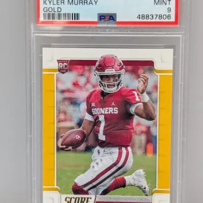 Sale Photo Thumbnail #118: PSA 9 Mint graded 2019 Panini Score Gold Kyler Murray rookie card #384 in protective slab.