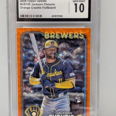 Sale Photo Thumbnail #83: CGC-graded Gem Mint 10 2024 Topps Update #US155 Jackson Chourio Orange Crackle Foilboard rookie card in a protective slab.