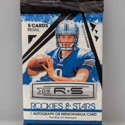 Sale Photo Thumbnail #431: Unopened 2009 Panini Rookies & Stars retail football card pack featuring Matthew Stafford on the wrapper.