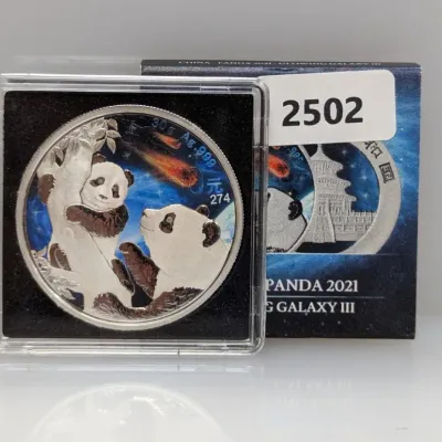 Sale Photo Thumbnail #993: 2021 Chinese Silver Panda 30g .999 fine silver coin from the Glowing Galaxy III series, complete with its original display capsule and box.