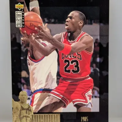 Sale Photo Thumbnail #340: 1997 Upper Deck Collector's Choice Michael Jordan 1985 NBA Rookie of the Year gold embossed card in good condition.