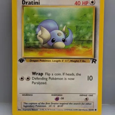 Sale Photo Thumbnail #642: 1st Edition Team Rocket Dratini Pokémon trading card, number 53/82, illustrated by Kagemaru Himeno, copyright 1999–2000.