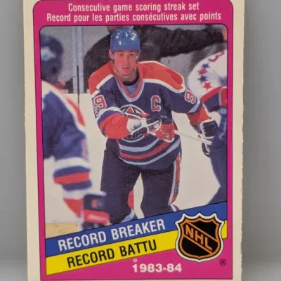 Sale Photo Thumbnail #427: 1983-84 O-Pee-Chee Wayne Gretzky Record Breaker hockey card #1, featuring his consecutive game scoring streak record in an Edmonton Oilers uniform.