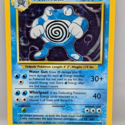 Sale Photo Thumbnail #162: Vintage 1999 Pokémon Base Set holographic Poliwrath trading card, numbered 13/102.