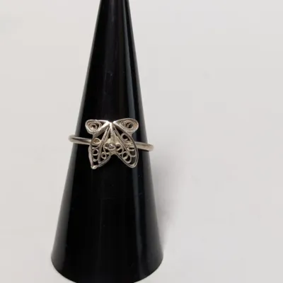 Sale Photo Thumbnail #964: Sterling silver filigree butterfly ring displayed on a black ring cone.