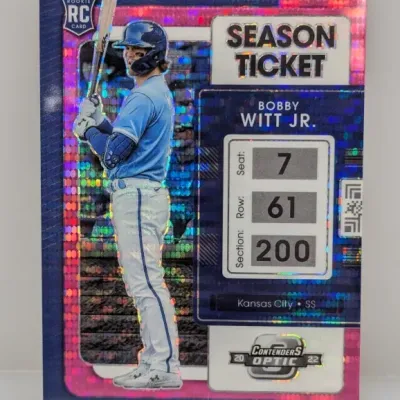 Sale Photo Thumbnail #94: 2022 Panini Contenders Optic Bobby Witt Jr. Season Ticket rookie card with a pink pulsar parallel finish.