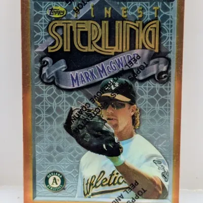 Sale Photo Thumbnail #619: 1996 Topps Finest Sterling Mark McGwire baseball card with original protective coating film intact.