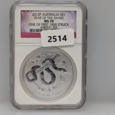 Sale Photo Thumbnail #1005: Graded 2013-P Australia $1 Year of the Snake silver coin, slabbed MS 70 and designated as 'One of First 1000 Struck'.