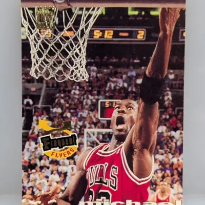 Sale Photo Thumbnail #930: 1994-95 Topps Stadium Club Frequent Flyers Michael Jordan basketball card #FF1 featuring gold foil details.