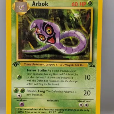 Sale Photo Thumbnail #534: 1st Edition Arbok #31/62 Pokémon trading card from the 1999 Fossil expansion set, illustrated by Ken Sugimori.