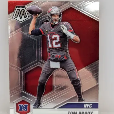 Sale Photo Thumbnail #938: Panini Mosaic Tom Brady football trading card featuring him in a Tampa Bay Buccaneers uniform.