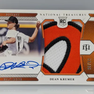 Sale Photo Thumbnail #347: Panini National Treasures Dean Kremer autographed rookie card featuring a multi-color jersey patch and numbered 98/99.