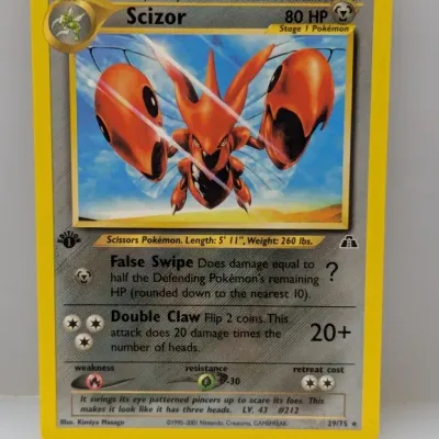 Sale Photo Thumbnail #713: 1st Edition Scizor #29/75 Pokémon trading card from the Neo Discovery set, released in 2001.