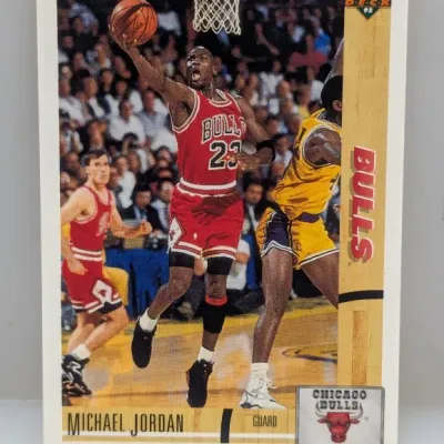 Sale Photo Thumbnail #896: 1991-92 Upper Deck Michael Jordan #34 basketball trading card featuring an in-game action photo.