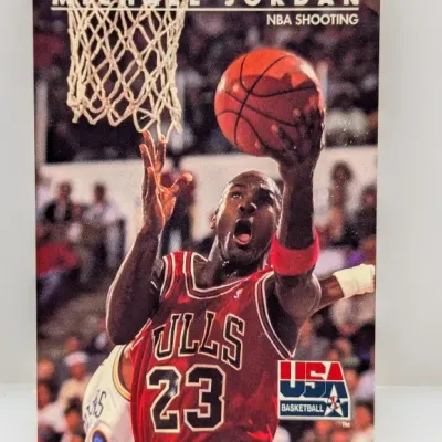 Sale Photo Thumbnail #419: 1991-92 SkyBox USA Basketball Michael Jordan trading card, #534, featuring an in-game photo of Jordan going up for a layup.