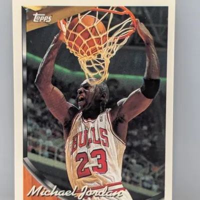 Sale Photo Thumbnail #460: 1992-93 Topps Michael Jordan #23 basketball card featuring a iconic dunks graphic, in clean condition.