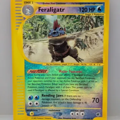 Sale Photo Thumbnail #56: Pokémon Expedition Base Set Feraligatr holo trading card (#12/165), dated 2002.