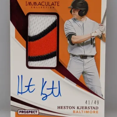 Sale Photo Thumbnail #331: Panini Immaculate Collection Heston Kjerstad autographed patch prospect card, numbered 41/49. Features an on-card signature and a multi-color jersey swatch.