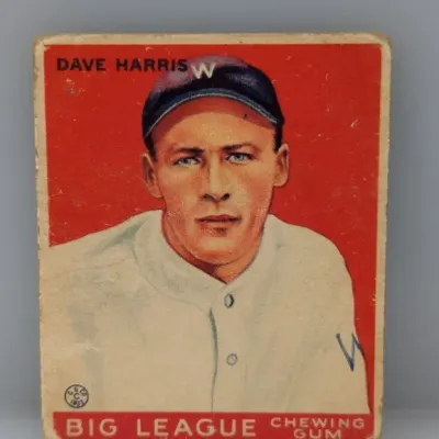 Sale Photo Thumbnail #425: 1933 Goudey #120 Dave Harris baseball card, featuring a red background portrait of the Washington Senators player with visible edge and corner wear.