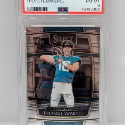 Sale Photo Thumbnail #81: PSA-graded 8 NM-MT 2021 Panini Select Trevor Lawrence rookie card #43 in a protective slab.