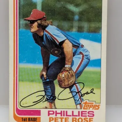 Sale Photo Thumbnail #649: 1980 Topps Pete Rose baseball card (#600) featuring his 1st Base position with the Philadelphia Phillies, showing mild edge and surface wear.