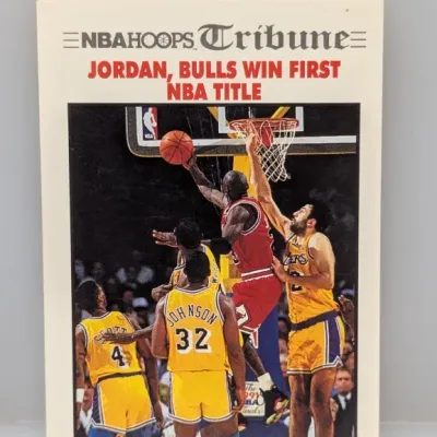Sale Photo Thumbnail #327: 1991-92 NBA Hoops Tribune Michael Jordan trading card, #530, featuring the "Jordan, Bulls Win First NBA Title" headline.