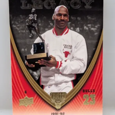 Sale Photo Thumbnail #797: Upper Deck Michael Jordan Legacy basketball trading card depicting his 1991-92 NBA Most Valuable Player award in good condition.