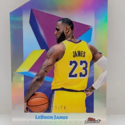 Sale Photo Thumbnail #355: LeBron James Topps Finest die-cut refractor basketball trading card, hand-numbered 61/74.