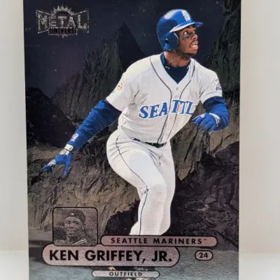 Sale Photo Thumbnail #569: 1998 Metal Universe Ken Griffey Jr. Seattle Mariners baseball trading card (#24) featuring a metallic dark background.