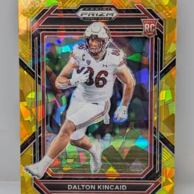 Sale Photo Thumbnail #336: 2023 Panini Prizm Draft Picks Dalton Kincaid rookie card featuring a gold cracked ice parallel finish.