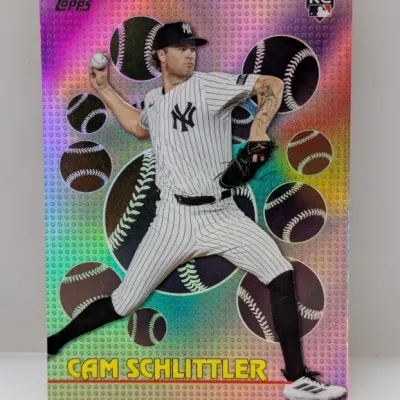 Sale Photo Thumbnail #584: Topps Cam Schlittler rookie baseball card featuring a pink rainbow foil parallel design with baseball graphic accents.