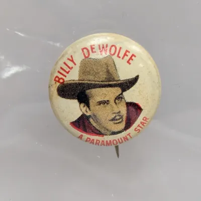 Sale Photo Thumbnail #69: Vintage Billy De Wolfe "A Paramount Star" promotional pinback button, featuring an illustrated portrait of the actor in a cowboy hat.