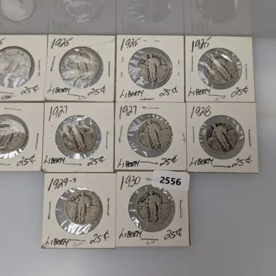 Sale Photo Thumbnail #1047: Collection of ten Standing Liberty silver quarters dating from 1925 to 1930, individually housed in cardboard coin flips.
