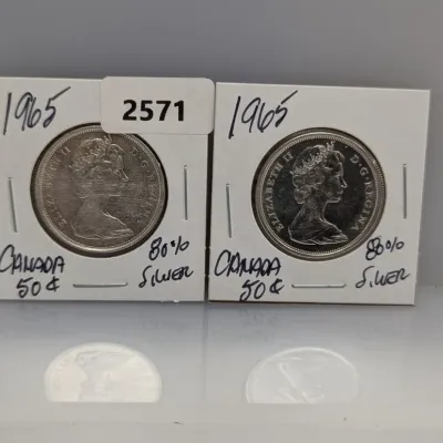Sale Photo Thumbnail #1067: Pair of 1965 Canadian 50-cent silver coins featuring Queen Elizabeth II, housed in labeled 2x2 cardboard flips.