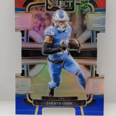 Sale Photo Thumbnail #628: 2023 Panini Select Jahmyr Gibbs rookie football trading card featuring a die-cut design and red, white, and blue refractor finish.