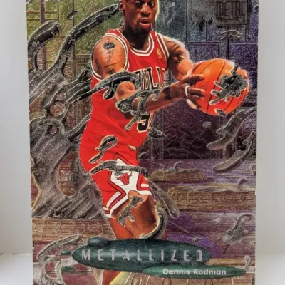 Sale Photo Thumbnail #700: 1996-97 Fleer Metal Metallized Dennis Rodman basketball trading card featuring the Chicago Bulls power forward in action.