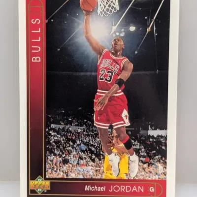 Sale Photo Thumbnail #894: 1993-94 Upper Deck Michael Jordan #23 basketball card featuring him driving for a layup against the Los Angeles Lakers.
