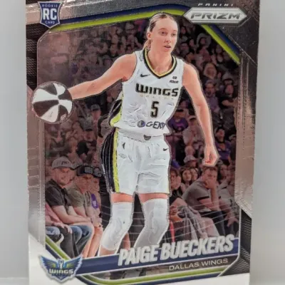 Sale Photo Thumbnail #382: Panini Prizm Paige Bueckers rookie card featuring her in a Dallas Wings uniform, presented in excellent condition.