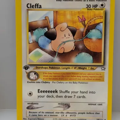 Sale Photo Thumbnail #696: 1st Edition Cleffa Pokémon trading card from the Neo Genesis set, number 20/111, released in 2000.