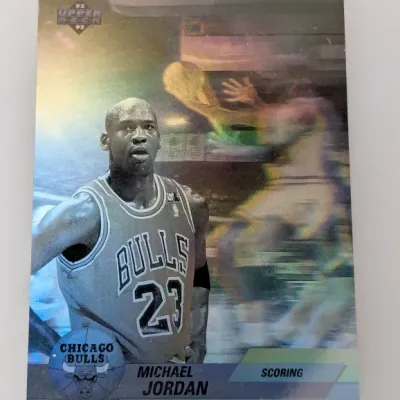 Sale Photo Thumbnail #881: 1992-93 Upper Deck Michael Jordan hologram trading card, featuring the Chicago Bulls scoring leader in good collectible condition.
