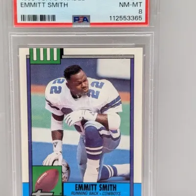 Sale Photo Thumbnail #198: PSA 8 NM-MT graded 1990 Topps Traded Emmitt Smith rookie sports card #27T in a protective slab.