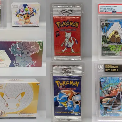 Sale Photo Thumbnail #2: Collection of collectible trading card merchandise, including sealed Pokémon Elite Trainer Boxes, booster packs in protective acrylic cases, a PSA-graded 9 Alolan Dugtrio card, and a Beckett Pristine 10 Edward.Newgate One Piece card.
